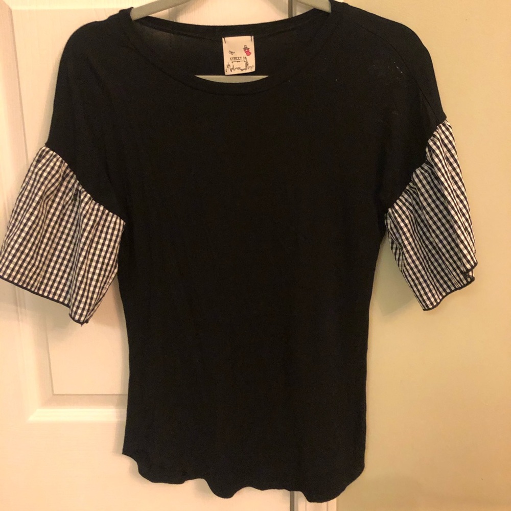 Blouse with black and white checkered sleeves